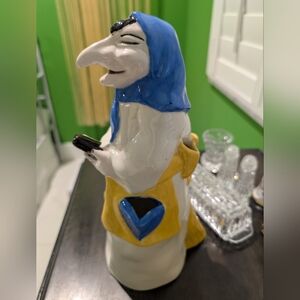 Colorful Ceramic Figurine with Blue and Yellow Accents